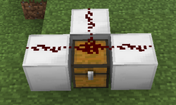 A T-junction redstone line over a chest