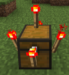 All 5 types of redstone torches on a chest