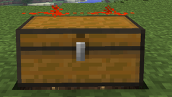 Two pieces of redstone on top of a double chest both at power strength 15