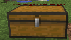 Two pieces of redstone on top of a double chest