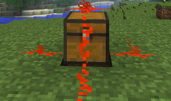 Redstone on a chest connected down all 4 sides of it with a power strength of 15