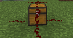 Redstone on a chest connected down all 4 sides of it
