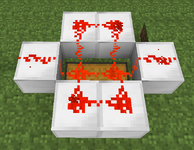 Two pieces of redstone on a double chest connected up all 4 sides of it onto iron blocks with a power strength of 15