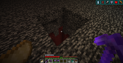 A 3x3 hole in the Nether ceiling done in survival with a headless piston method.
